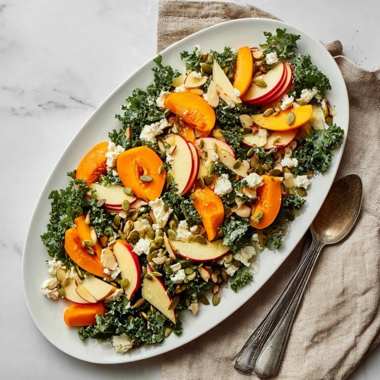 Healthy Christmas Kale & Persimmon Salad with Pear, Goat Cheese, and Nuts Recipe